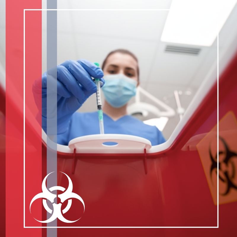 Flint sharps img3 Nurse dropping a needle into a red waste bin